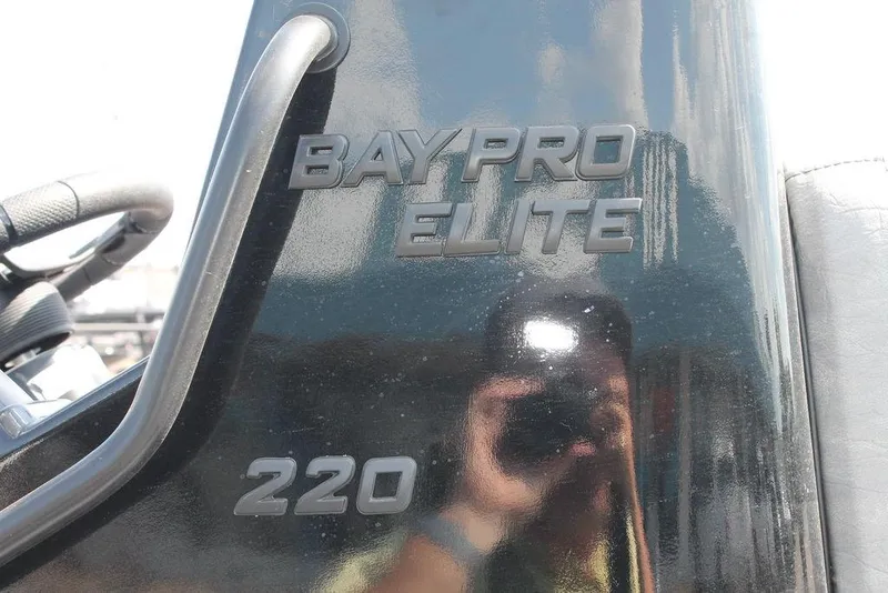 Slide: The Image of Close-up of 2026 Excel Bay Pro Elite 220 boat model nameplate. - 5