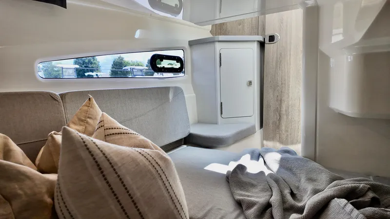 Slide: The Image of Interior of 2026 Bayliner Trophy 29 Explorer, featuring cozy seating and modern design elements. - 18