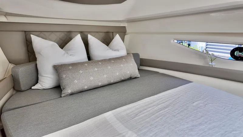 Slide: The Image of Luxurious cabin interior of 2026 Bayliner Trophy 29 Explorer with plush bedding and modern design. - 26
