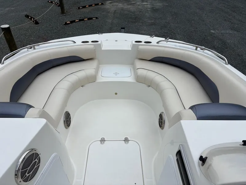 Slide: The Image of Spacious seating area on a 2016 Hurricane 188 boat, featuring comfortable cushions and cup holders. - 5