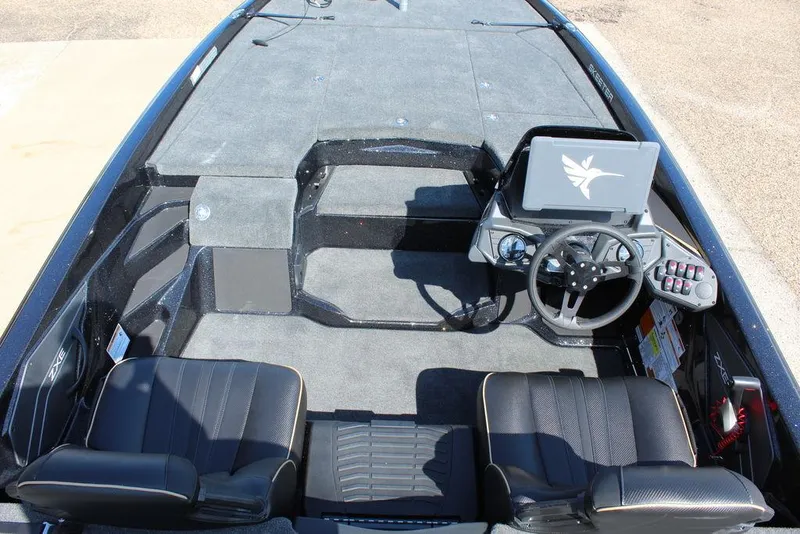 Slide: The Image of 2026 Skeeter ZXE21 boat interior with dual seats, steering wheel, and control panel. - 12