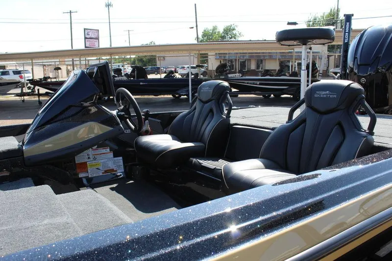 Slide: The Image of 2026 Skeeter ZXE21 boat interior with dual seats and steering console. - 15