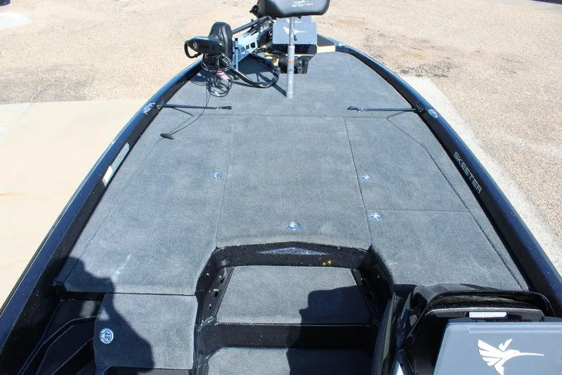 Slide: The Image of 2026 Skeeter ZXE21 boat deck with trolling motor and storage compartments. - 18