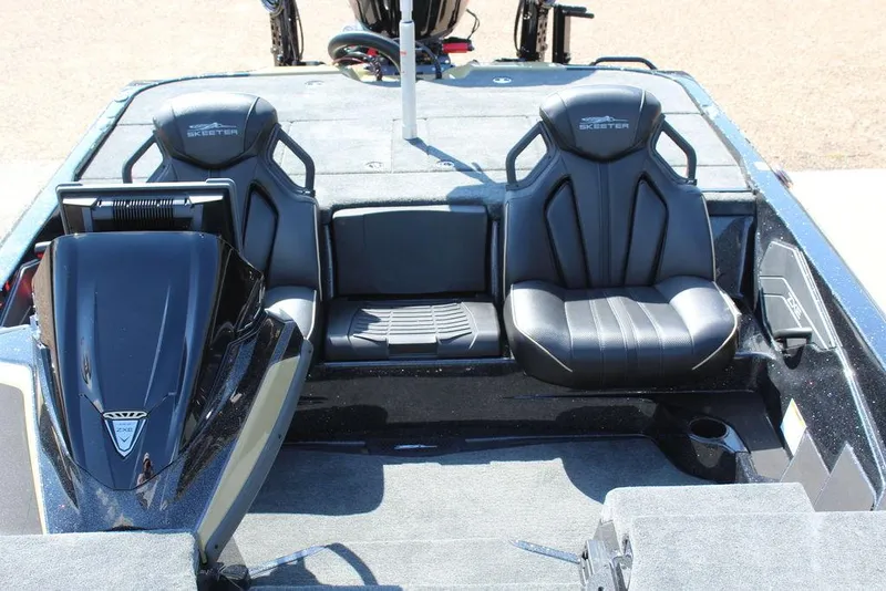 Slide: The Image of 2026 Skeeter ZXE21 boat interior with black seats and sleek design. - 22
