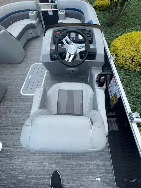 Slide: The Image of 2024 Bennington 22SXSWB boat interior with steering wheel and seating. - 8