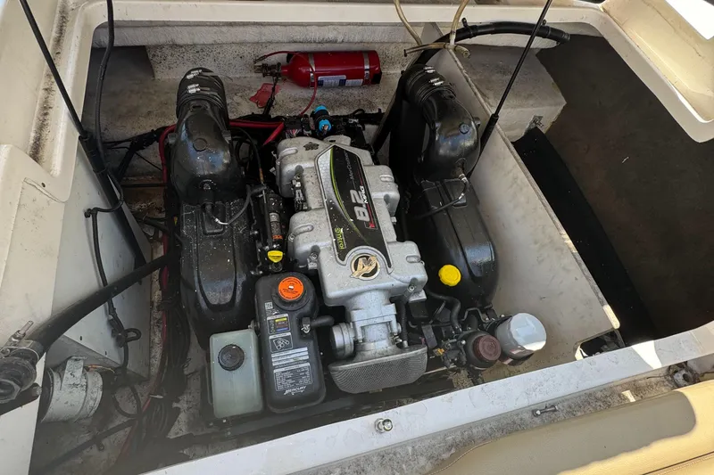 Slide: The Image of Engine compartment of a 2015 Sea Ray 290 Sundeck boat, featuring a well-maintained motor. - 22