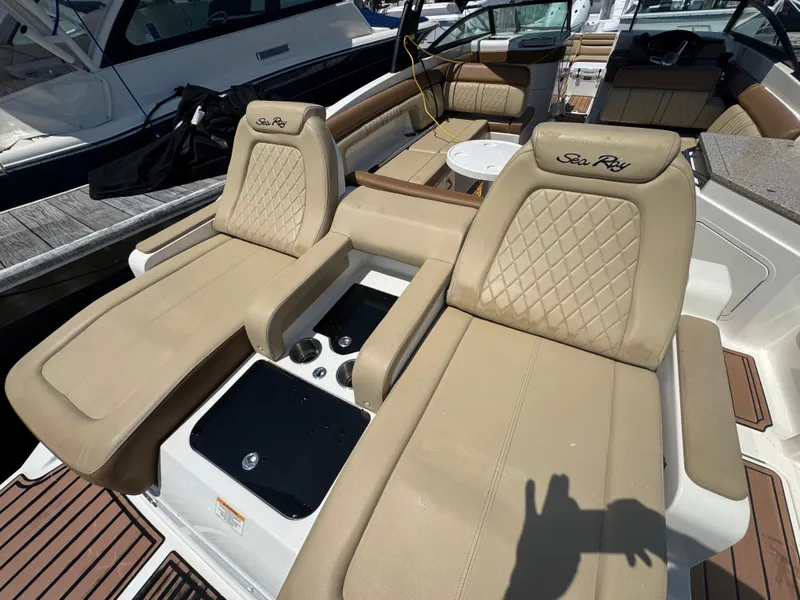 Slide: The Image of 2015 Sea Ray 290 Sundeck with luxurious tan seating and elegant interior design. - 8