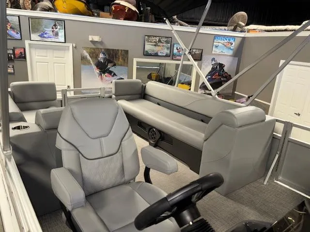 Slide: The Image of 2025 Tahoe Pontoon SLT 2180 QL interior with gray seating and modern design. - 11