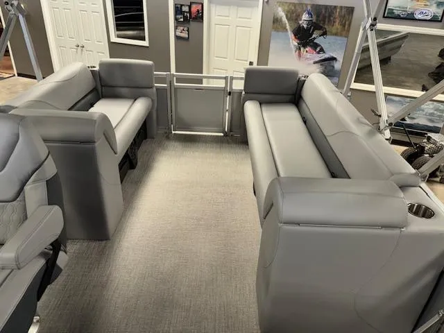 Slide: The Image of 2025 Tahoe Pontoon SLT 2180 QL interior with gray seating and modern design. - 13