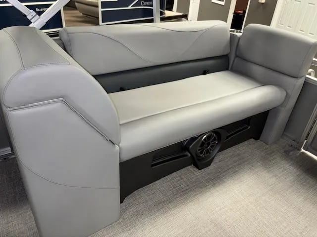 Slide: The Image of 2025 Tahoe Pontoon SLT 2180 QL, gray seating with integrated speaker system. - 17