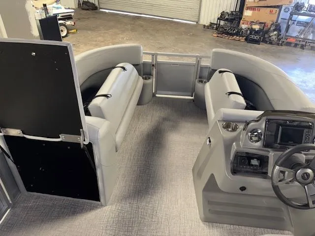 Slide: The Image of 2025 Tahoe Pontoon SLT 2180 QL interior with gray seating and steering console. - 20