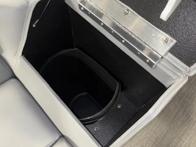 Slide: The Image of Open storage compartment in 2025 Tahoe Pontoon SLT 2180 QL boat seat. - 22
