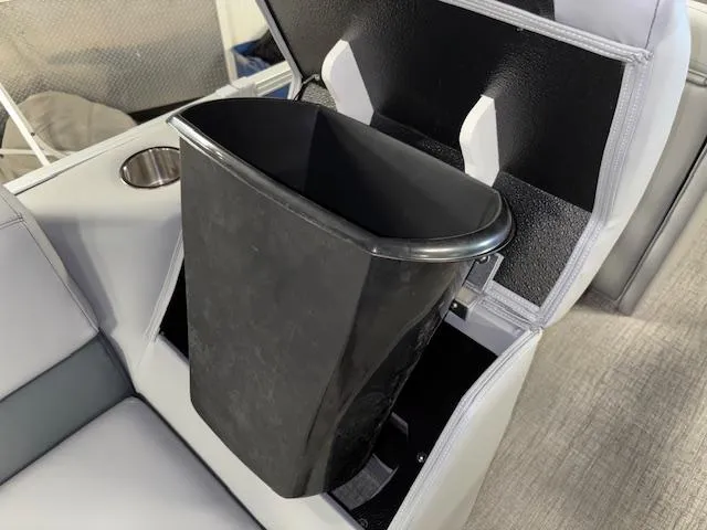 Slide: The Image of 2025 Tahoe Pontoon SLT 2180 QL with integrated trash bin and cup holder. - 23