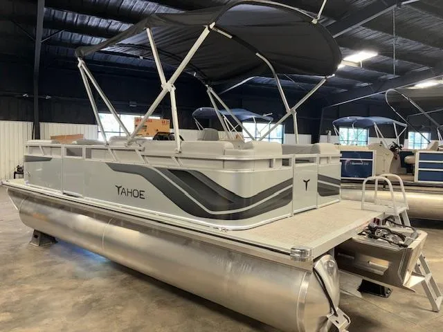 Slide: The Image of 2025 Tahoe Pontoon SLT 2180 QL with canopy in showroom setting. - 4