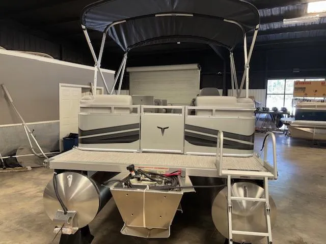 Slide: The Image of 2025 Tahoe Pontoon SLT 2180 QL in showroom, featuring sleek design and sturdy build. - 5