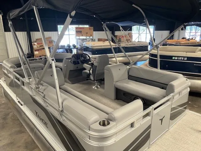 Slide: The Image of 2025 Tahoe Pontoon SLT 2180 QL with canopy, showcased indoors. - 9