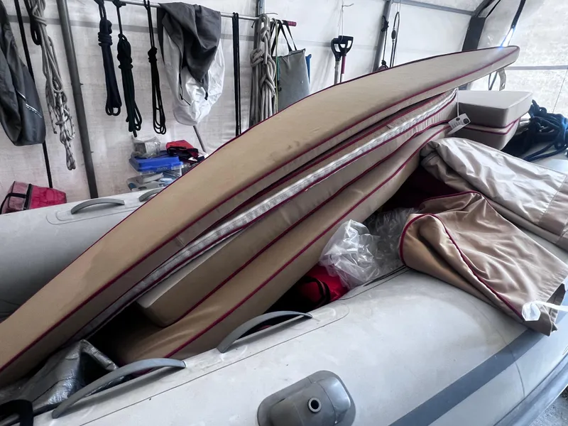 Slide: The Image of Inflatable boat with cushions and gear in storage, Arey's Pond 16, 2007 model. - 16