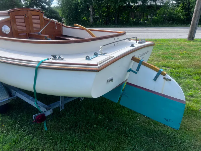Slide: The Image of Arey's Pond 16 sailboat from 2007 on trailer, featuring wooden accents and rudder. - 5