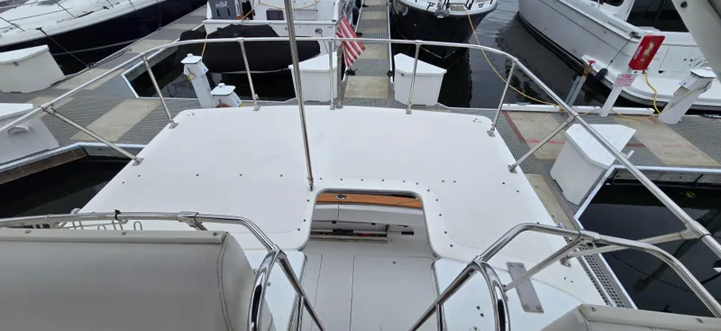 Slide: The Image of 1991 Bayliner 3288 Motoryacht docked at marina, view from upper deck. - 11
