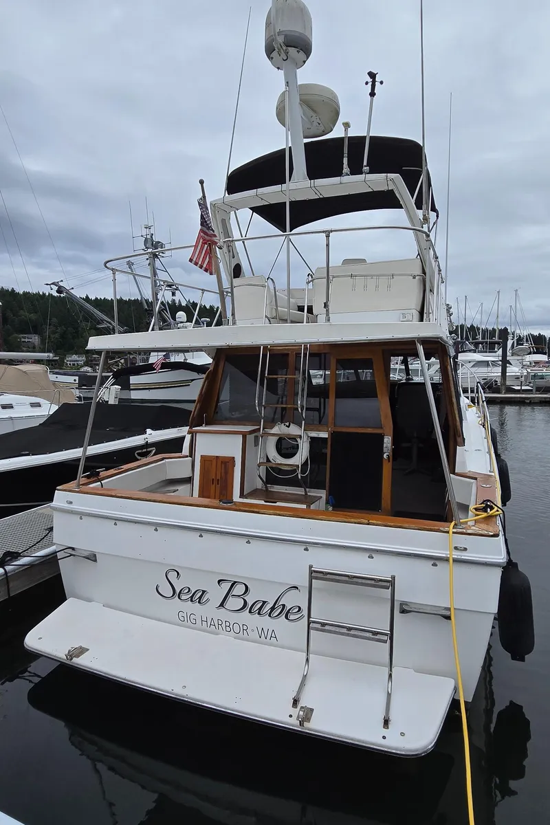 Slide: The Image of 1991 Bayliner 3288 Motoryacht docked at marina, named "Sea Babe," Gig Harbor, WA. - 2