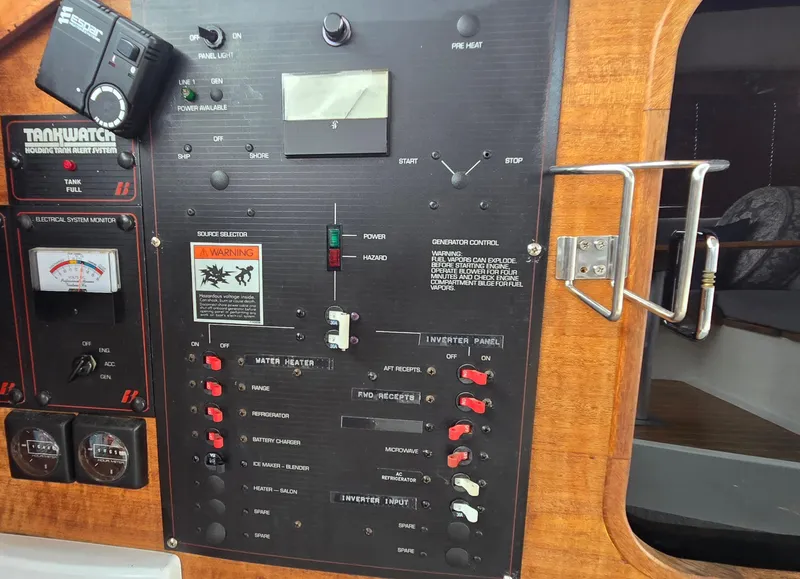 Slide: The Image of Control panel of a 1991 Bayliner 3288 Motoryacht with various switches and gauges. - 20
