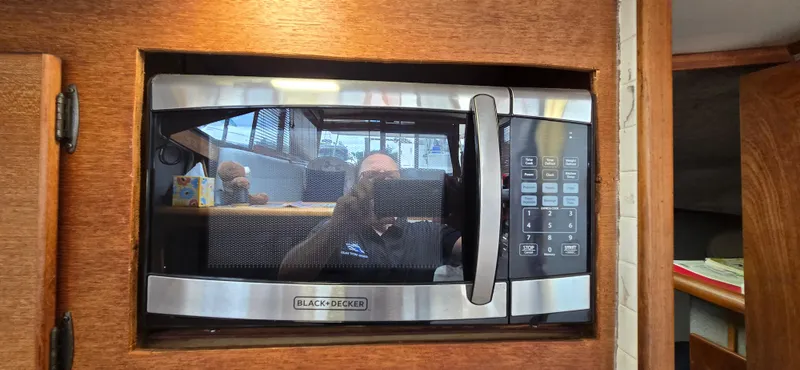 Slide: The Image of Built-in Black & Decker microwave in 1991 Bayliner 3288 Motoryacht kitchen. - 25