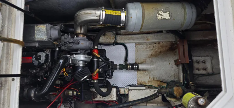 Slide: The Image of Engine compartment of a 1991 Bayliner 3288 Motoryacht, showing mechanical components and wiring. - 38