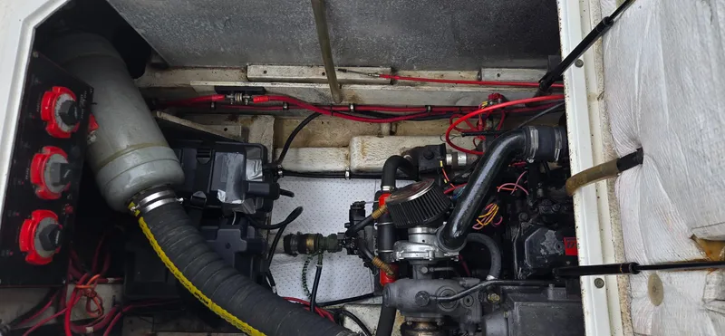 Slide: The Image of Engine compartment of a 1991 Bayliner 3288 Motoryacht, showing mechanical components and wiring. - 39