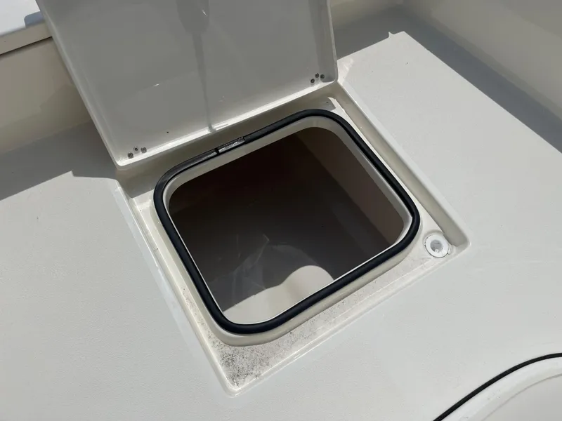 Slide: The Image of Open hatch on Avenger AV26 boat, 2026 model, showing storage compartment. - 11