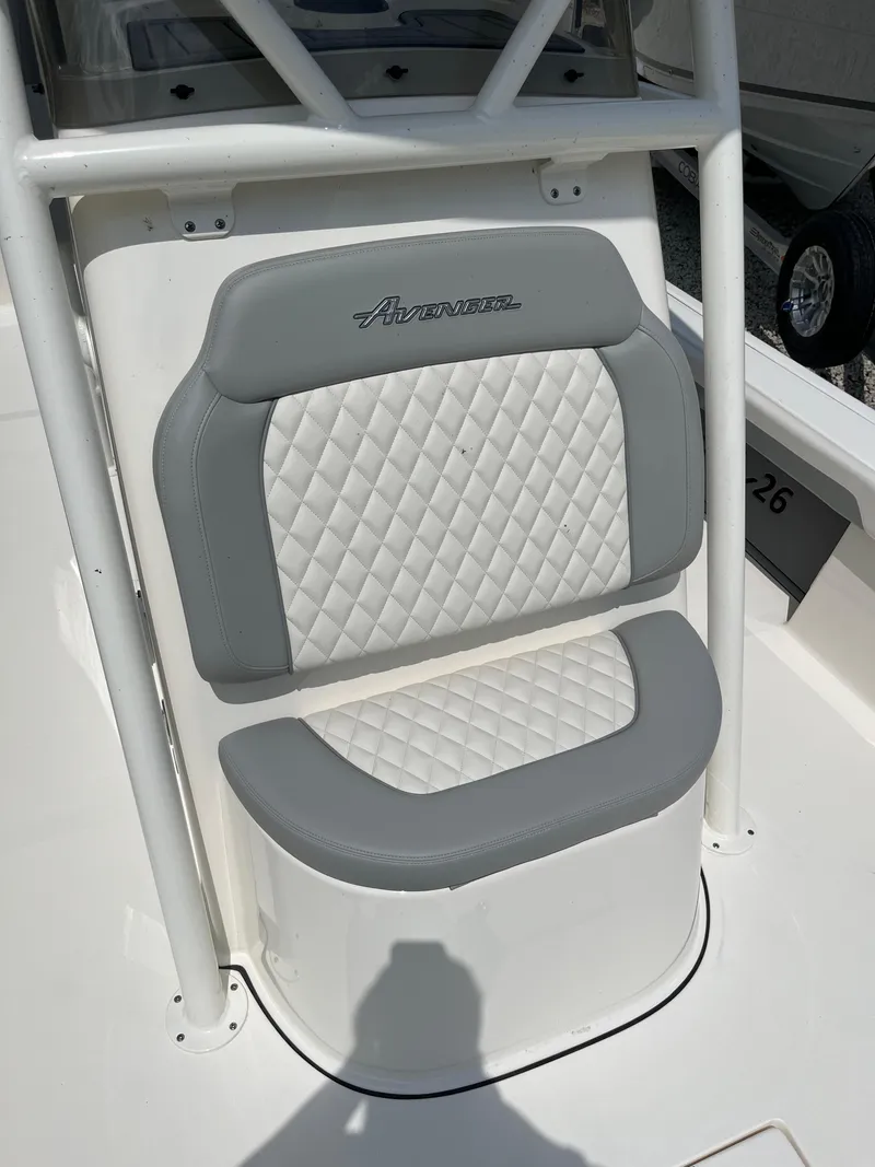 Slide: The Image of 2026 Avenger AV26 boat seat with quilted white and gray upholstery. - 13