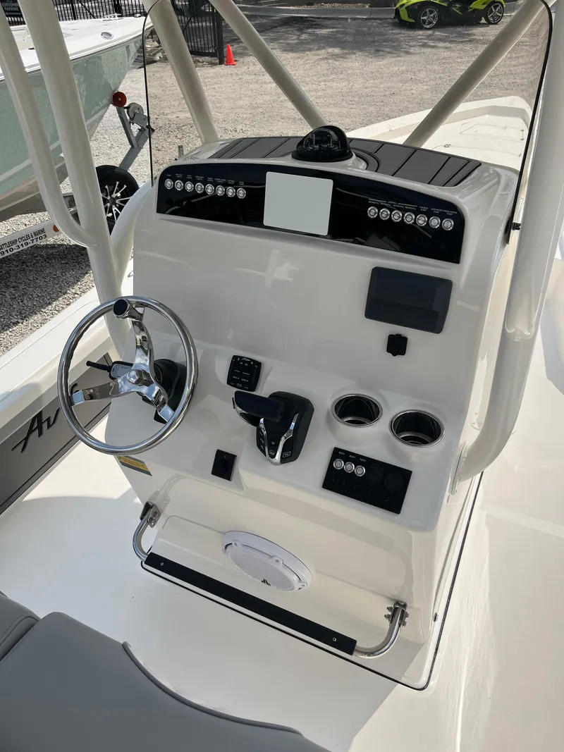 Slide: The Image of Avenger AV26 2026 boat console with steering wheel and controls. - 15