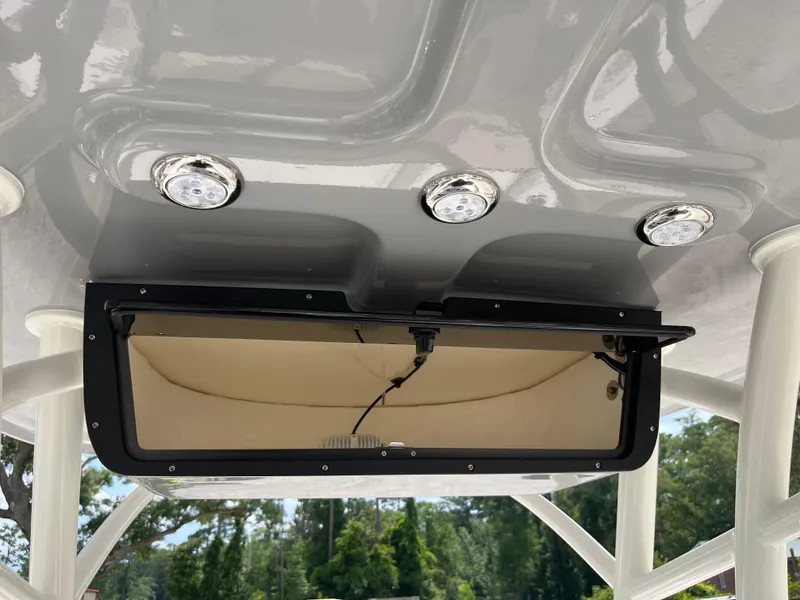 Slide: The Image of Avenger AV26 2026 boat ceiling with built-in lights and storage compartment. - 19