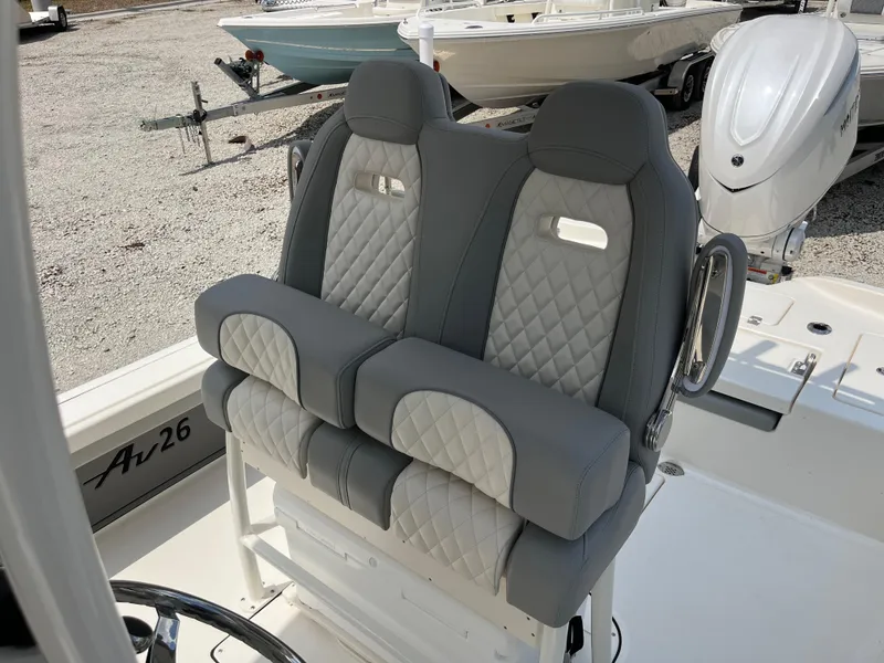 Slide: The Image of Luxurious seating on 2026 Avenger AV26 boat, featuring quilted upholstery and modern design. - 20