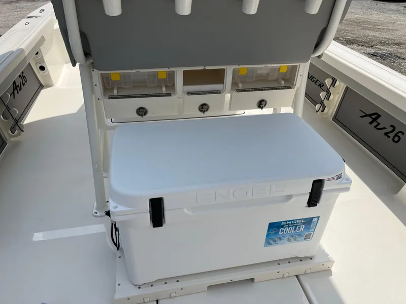 Slide: The Image of 2026 Avenger AV26 boat interior with Engel cooler and storage compartments. - 26