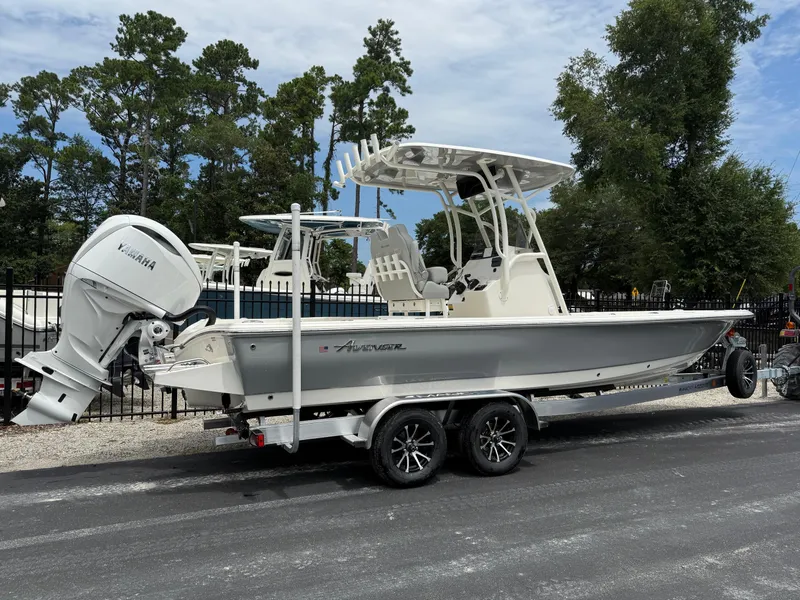 Slide: The Image of 2026 Avenger AV26 boat with Yamaha engine on trailer, parked outdoors. - 3