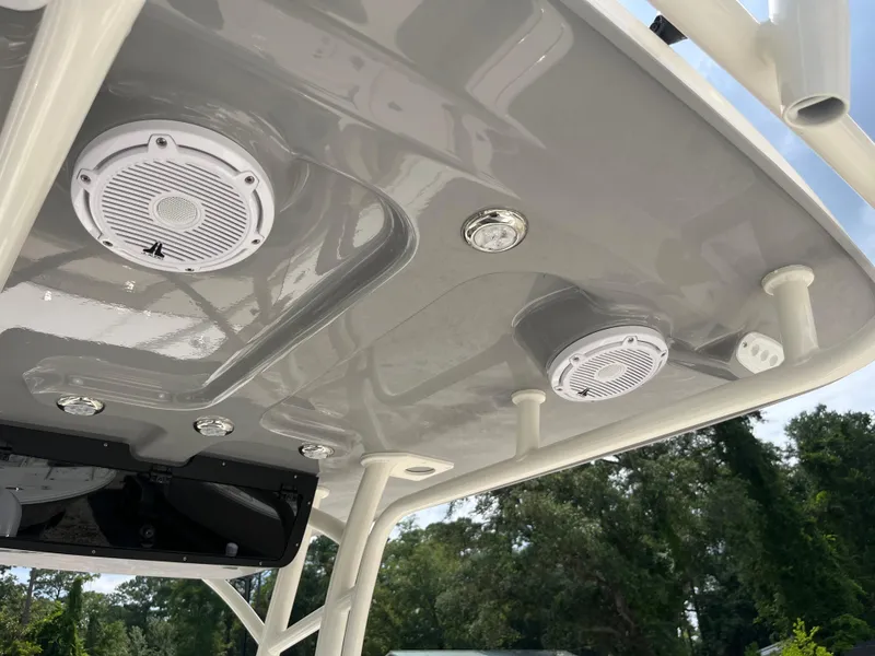 Slide: The Image of 2026 Avenger AV26 boat ceiling with speakers and lights, outdoor setting. - 31