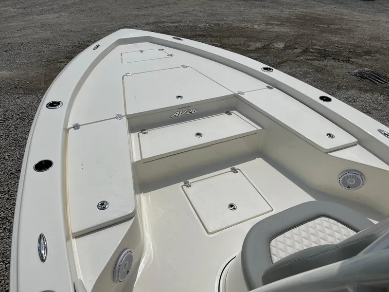 Slide: The Image of 2026 Avenger AV26 boat deck with storage compartments and seating. - 6