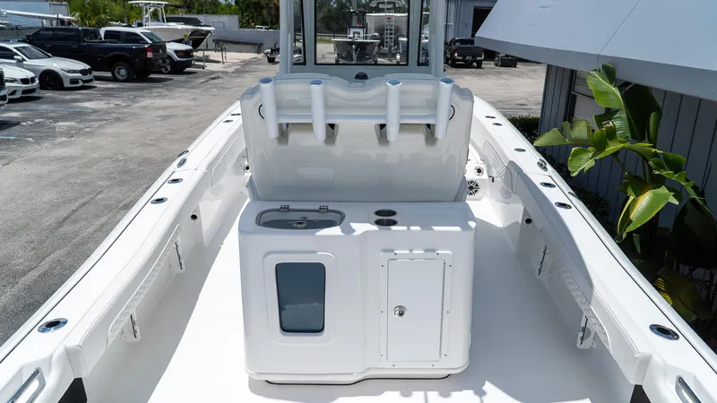 Slide: The Image of 2026 Tidewater 2700 Carolina Bay boat interior with console and rod holders. - 10