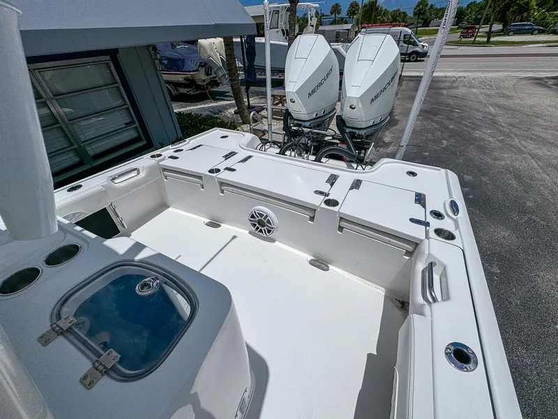 Slide: The Image of 2026 Tidewater 2700 Carolina Bay boat with dual Mercury engines, spacious deck, and storage compartments. - 11
