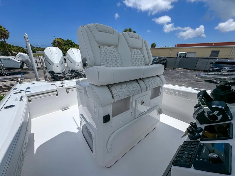 Slide: The Image of 2026 Tidewater 2700 Carolina Bay boat interior with dual seats and control panel. - 19