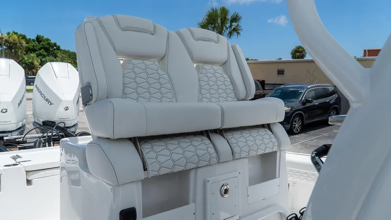 Slide: The Image of 2026 Tidewater 2700 Carolina Bay boat with luxurious seating and Mercury engines. - 20