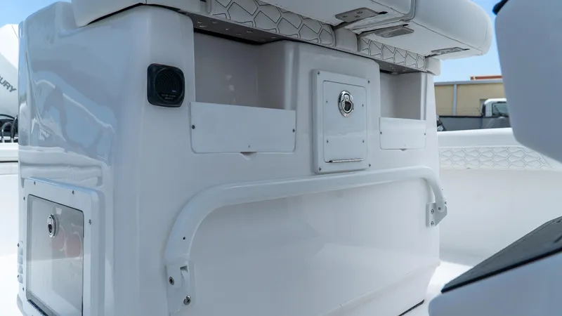 Slide: The Image of 2026 Tidewater 2700 Carolina Bay boat interior, featuring storage compartments and seating. - 22