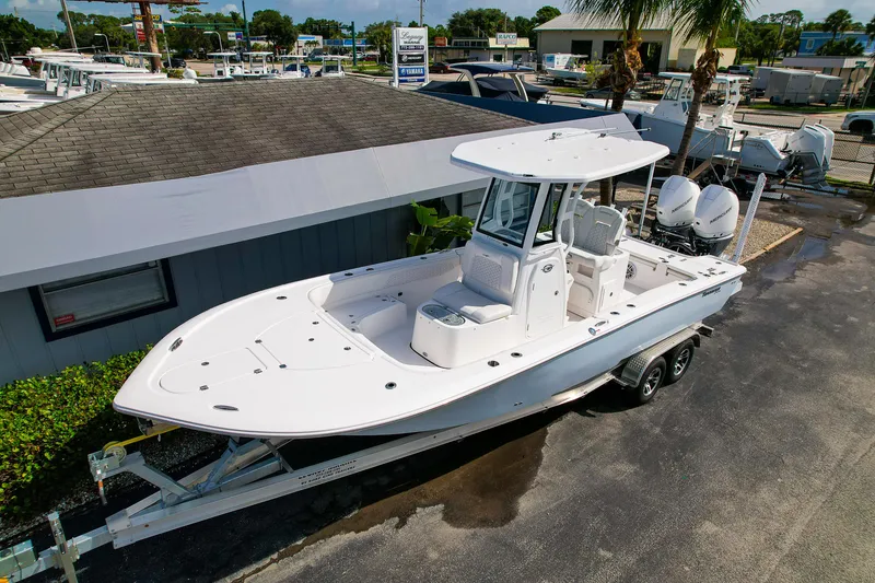 Slide: The Image of 2026 Tidewater 2700 Carolina Bay boat on trailer at dealership. - 5