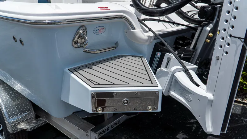 Slide: The Image of 2026 Tidewater 2700 Carolina Bay boat stern with step platform and trailer. - 8