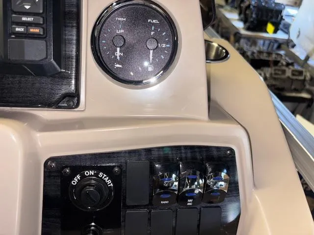 Slide: The Image of Dashboard controls of 2025 Tahoe Pontoon STX 1980 CR boat. - 14
