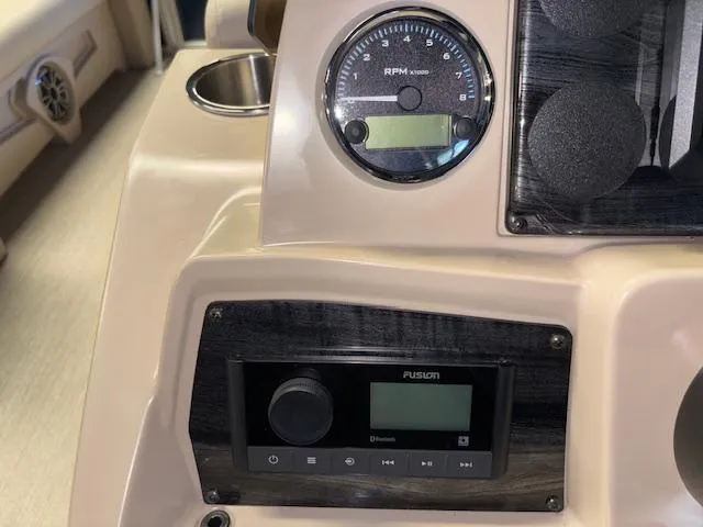Slide: The Image of Dashboard of 2025 Tahoe Pontoon STX 1980 CR with RPM gauge and Fusion audio system. - 15