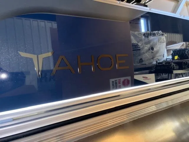Slide: The Image of 2025 Tahoe Pontoon STX 1980 CR logo on boat exterior. - 22