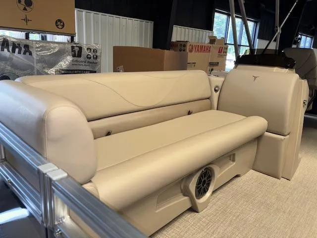 Slide: The Image of 2025 Tahoe Pontoon STX 1980 CR interior with beige seating and modern design. - 5