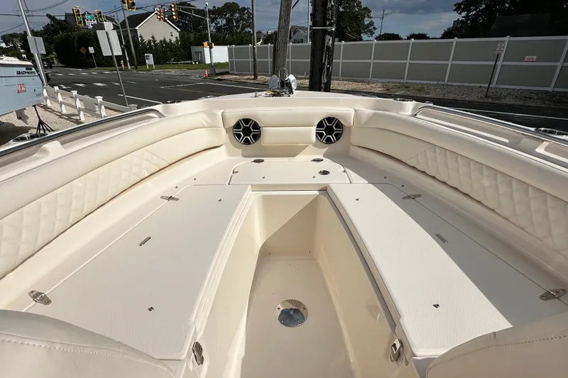 Slide: The Image of 2026 Grady-White Freedom 235 boat interior with spacious seating and modern design. - 14
