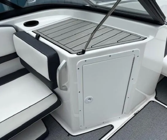 Slide: The Image of 2022 Yamaha AR195 boat interior with cushioned seating and storage compartment. - 14